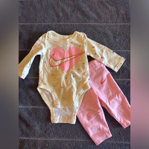 Newborn Nike onsie and matching pants. Good condition.